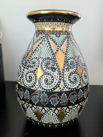 Hand-painted decorative ceramic vase with gold accents