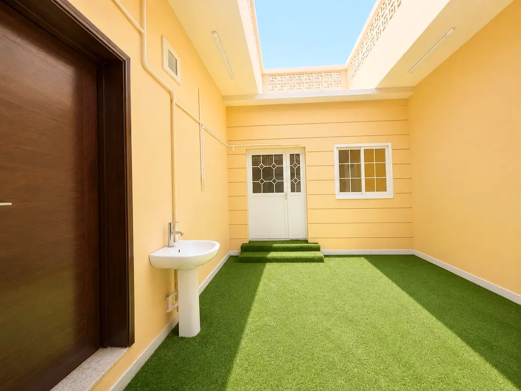 A traditional Arabic house with 3 master bedrooms, a spacious living room, a large private courtyard, an outdoor cooking area, a separate dining room,