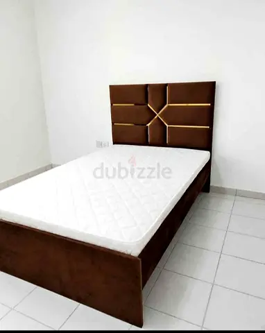 Brown upholstered single bed with foam mattress - good condition