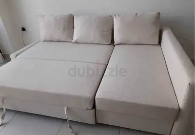 Light beige convertible sofa bed with storage - good condition