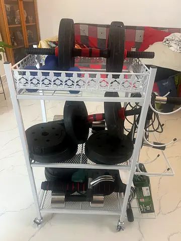 Home weight set with barbell, plates and dumbbells — good condition