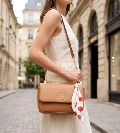 Light brown leather shoulder bag with gold chain detail