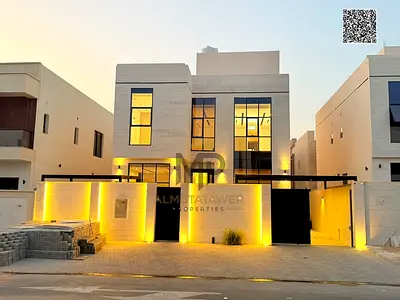 Luxury villa for sale in Ajman, featuring high-end finishes and a modern design; the price includes
