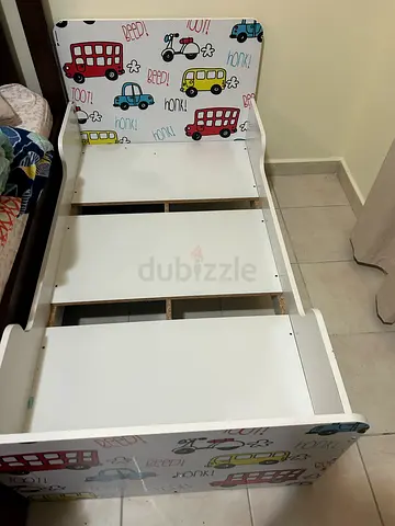 White Wooden Baby Crib Frame with Colorful Car Prints and mattress