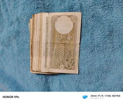 100 banknotes of the 5-Taka denomination.