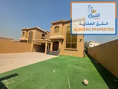 Villa featuring 5 master bedrooms, two large living areas, a majlis, and a maid's room. Prime locati