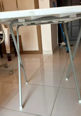 White folding plastic table with metal legs - good condition