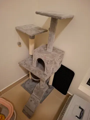 Grey multi-level cat tree with condo and scratching posts