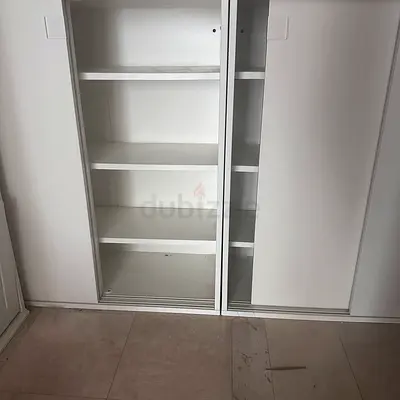 White built-in sliding wardrobe with shelves - good condition