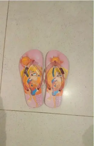 Girls pink flip flops with cartoon print