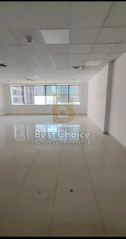 An office available for annual rent in the Al Majaz 3 area, featuring a prime location suitable 0for various business activities and including a parki