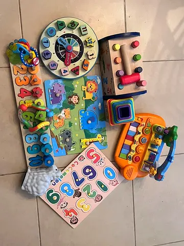 Bundle of Wooden Educational Baby Toys — Puzzles, Shape Sorters, Clock and inflatable sensor ring