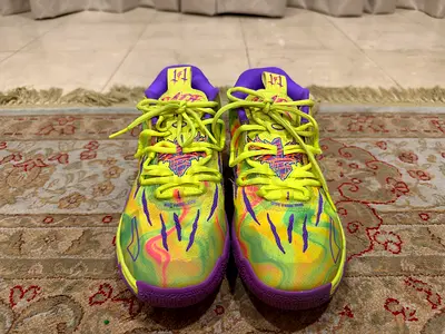 PUMA LaMelo Ball MB.03 Spark Older Kids EU 41 Bright yellow-green basketball shoes with bold pink.