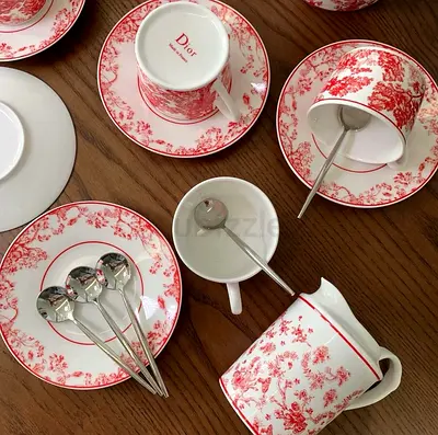 Dior red floral porcelain tea set — cups, saucers, creamer & spoons