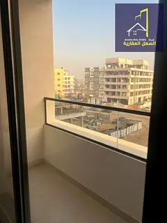 One-bedroom apartment for annual rent in Muwaileh. Brand-new building, first tenant, located in a pr