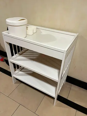 White changing table with accessories