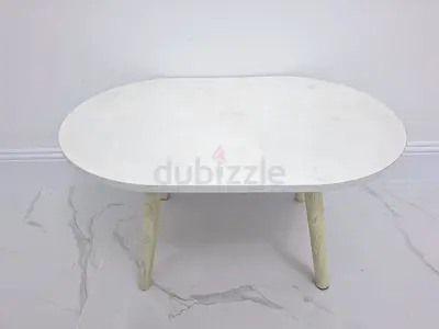 White Oval Coffee Table with Wooden Legs - well used