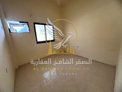 A two-bedroom apartment with a living room in Al Yarmook, featuring modern finishes and an open view. Maintenance is covered by the landlord, payment