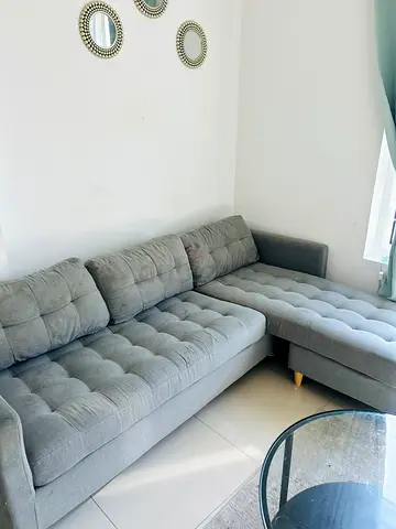 Light grey L-shaped 3-seater sofa with chaise, good condition