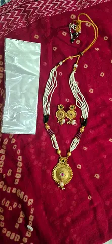 Navratri Traditional gold-tone necklace set with matching earrings and maang tikka