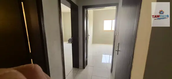 For staff: Two-bedroom apartment with living room for annual rent in Al Muwaihat 3