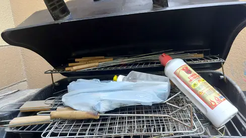 Portable charcoal grill with grill racks and accessories - good condition