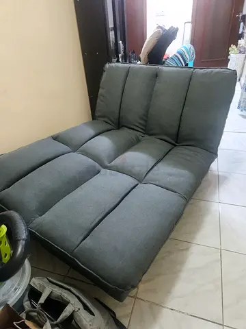 Grey fabric 3-seater sofa bed in good condition