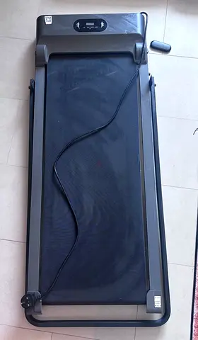 Compact under-desk walking treadmill in working condition.