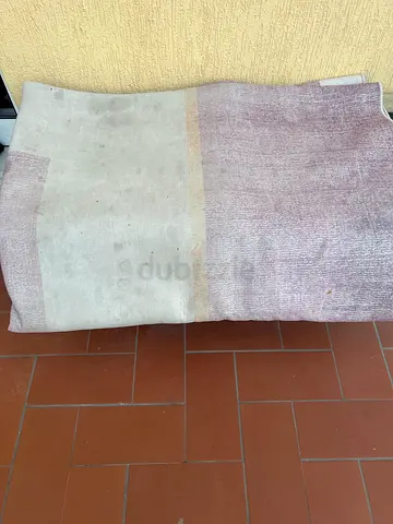 Light beige and mauve area rug - gently used, some stains