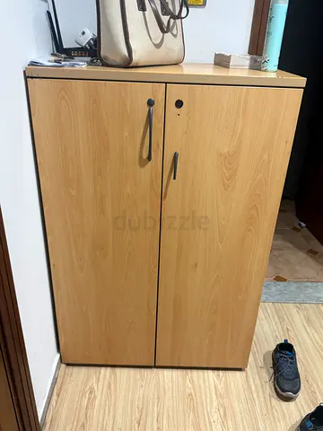 Light wood two-door wardrobe / storage cabinet in good condition