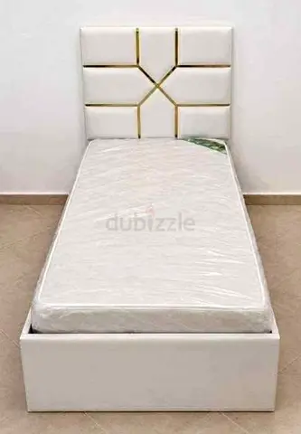 Single white upholstered bed with storage and new mattress