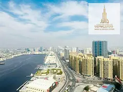 Rent 50k (6 cheques): 2BR in Oasis Towers 1, Al Rashidiya 1, Ajman. 2 baths, balcony, open view, bui