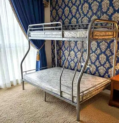 Metal Bunk Bed with Double Base and Single Top — Good Condition