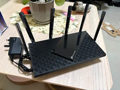 TP-Link AXE5400 Tri-Band WiFi 6E Router (Archer AXE75) with adapter