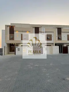A 5-bedroom townhouse with a rooftop terrace in Al Helio Center 2, featuring a prime location and an