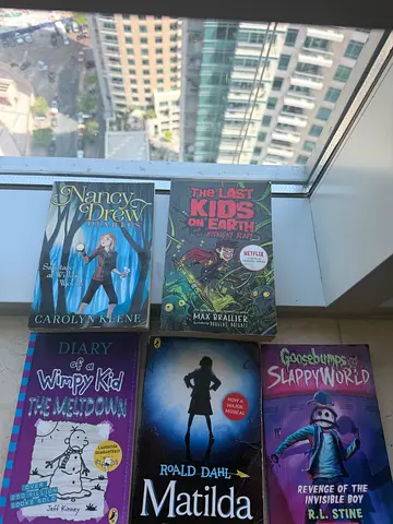 Collection of children's and young teen books including Matilda, Nancy Drew, Diary of a Wimpy Kid