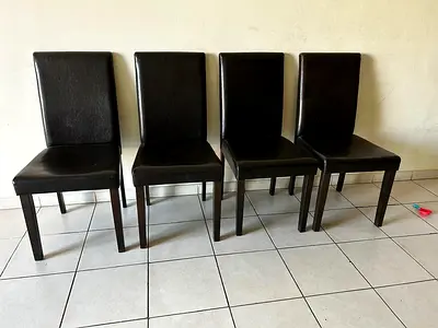 Set of 4 black faux leather dining chairs — sturdy, good condition