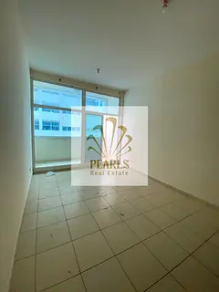 Experience luxury and comfort at Ajman One Towers: a unit featuring two master bedrooms, a living ro
