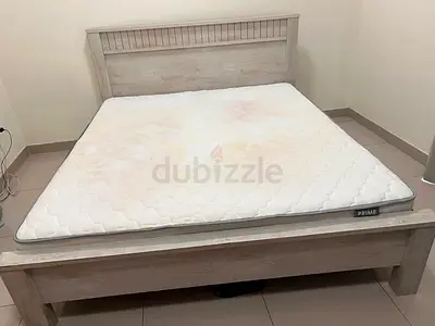 Queen bed frame with free mattress — light wood finish