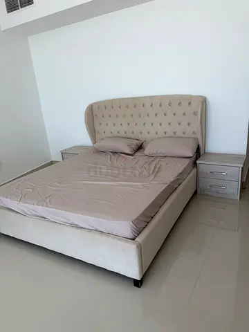 Upholstered King-Size Bed with Tufted Headboard and Two Bedside Tables