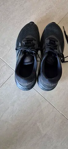 Used black Unisex running shoes - size unknown, good condition