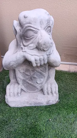 Pair of concrete garden statues with tall decorative planter