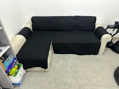 L-shaped 3-seater Sofa cum Bed - Cream upholstery with black covers