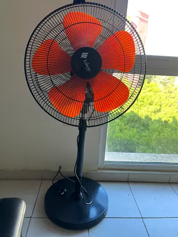 Tornado standing fan - orange blades, good working condition. Very good fan and sturdy and strong