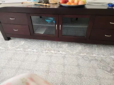 Dark wood storage cabinet with glass doors - good condition