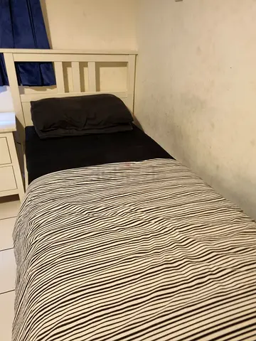 Single Ikea Bed, with mettras and bedside table with two drawers — good condition