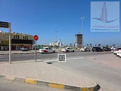 Residential/commercial land for sale on a main street, very prime location, one minute from Ajman Ma
