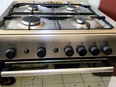 Used Italian Brand Ariston 4-Burner Stainless Steel Gas Cooker with Oven - Good Working Condition