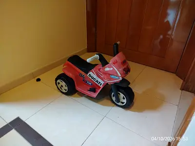 Red Ducati ride-on toddler motorcycle toy comes with charger
