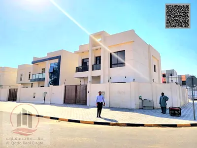 Villa for sale in Ajman, Al Zahiyah, 5 master bedrooms, majlis, living room, and maid's room. Freehold ownership for all nationalities.